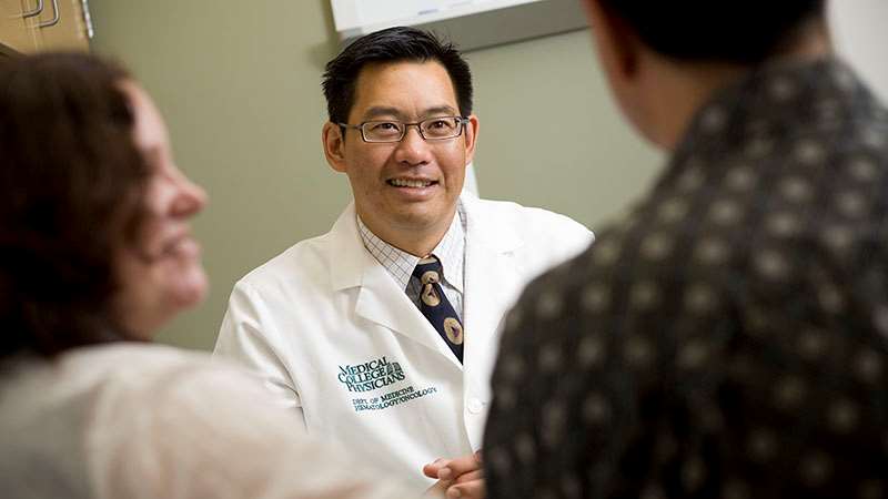 Stu Wong, MD with patients