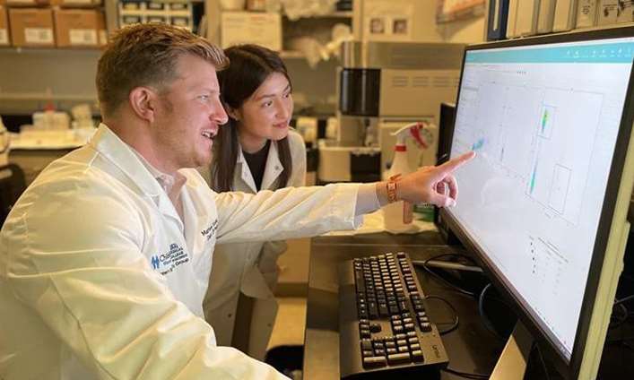 Dr Kudek and Researcher