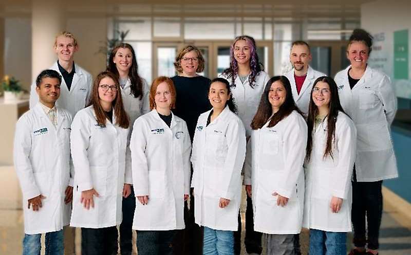 Members of the MCW Himburg laboratory posing for the camera in lab coats