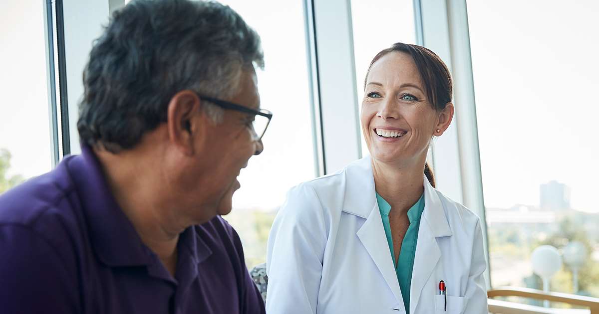 Male patient speaking with physician