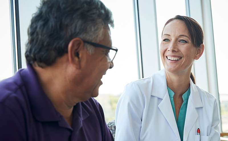 Male patient speaking with physician