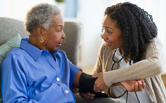 Nurse Taking Patients Blood Pressure