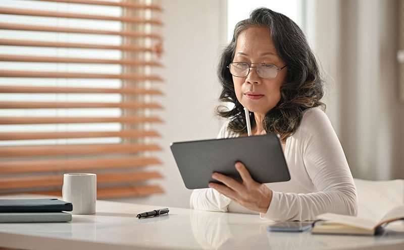 woman looking at iPad