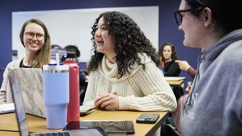 three female students in classroom